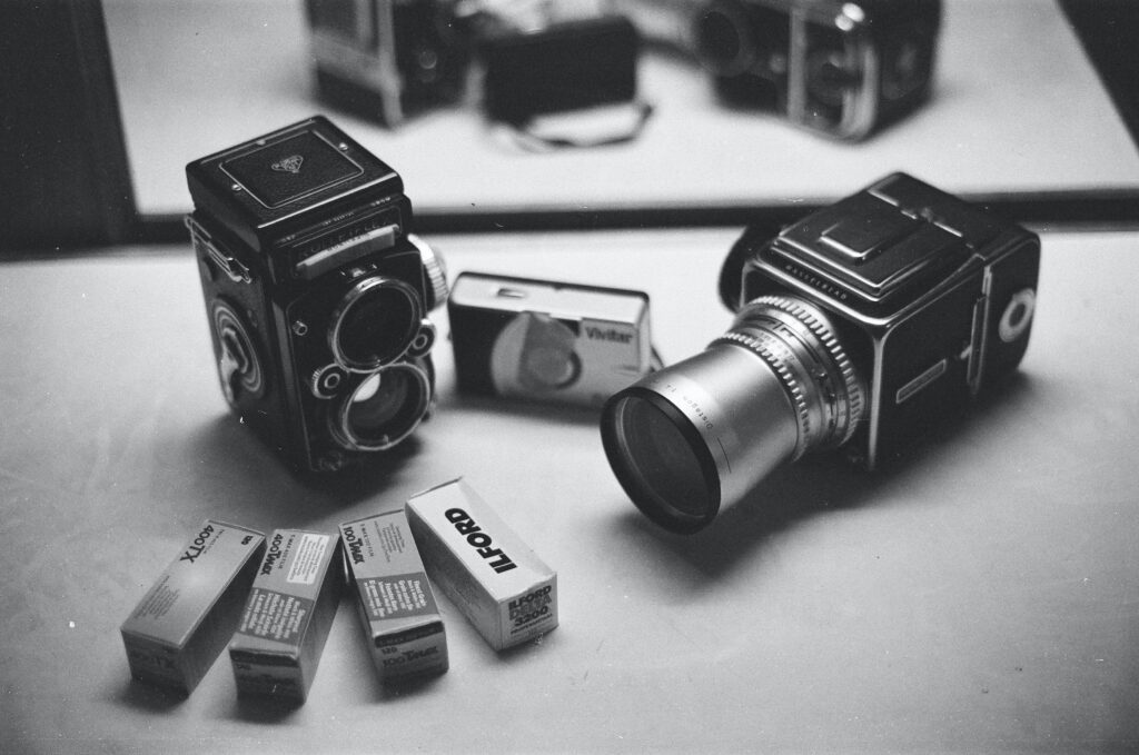 A photo comparing Medium Format and Full Frame cameras in black and white.