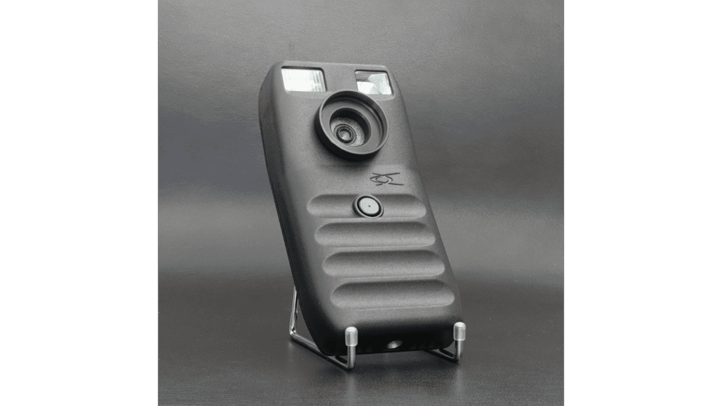 A black phone with an attached camera that revolutionized photography.