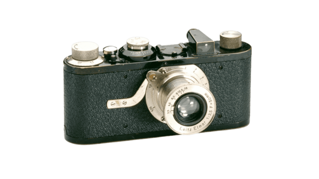An old camera on a white background, invented during an earlier time period.