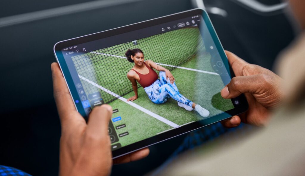 A person using an iPad to capture a picture of a tennis player in Capture One.