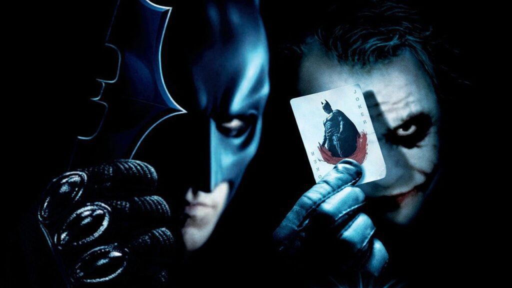 Batman actor holding cards.