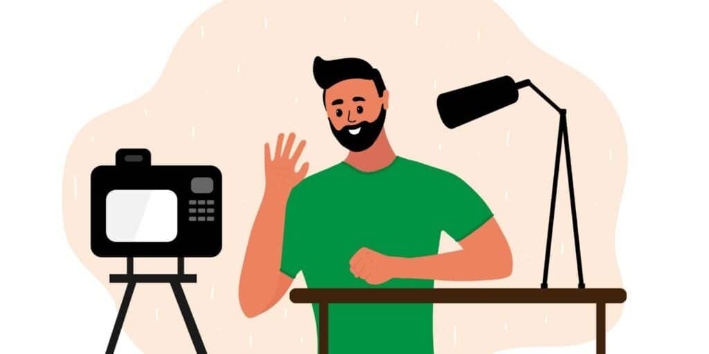 A man is sitting at a table with the best webcam for podcasting in front of him.