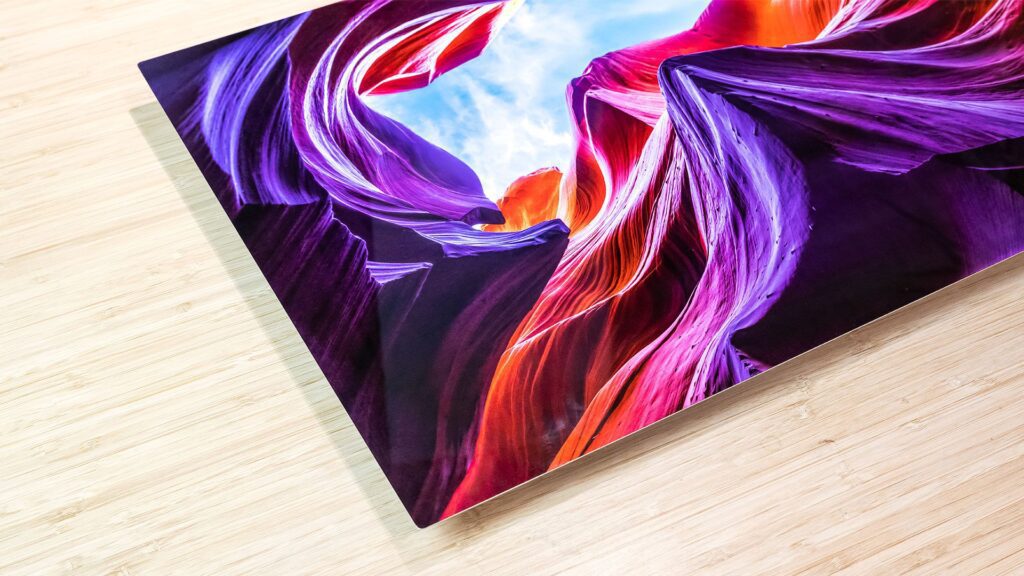 An image of a colorful painting on a wooden table, showcasing the vibrant colors of acrylic.