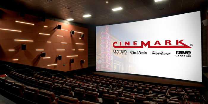 An auditorium with a screen that says Cinemark XD.