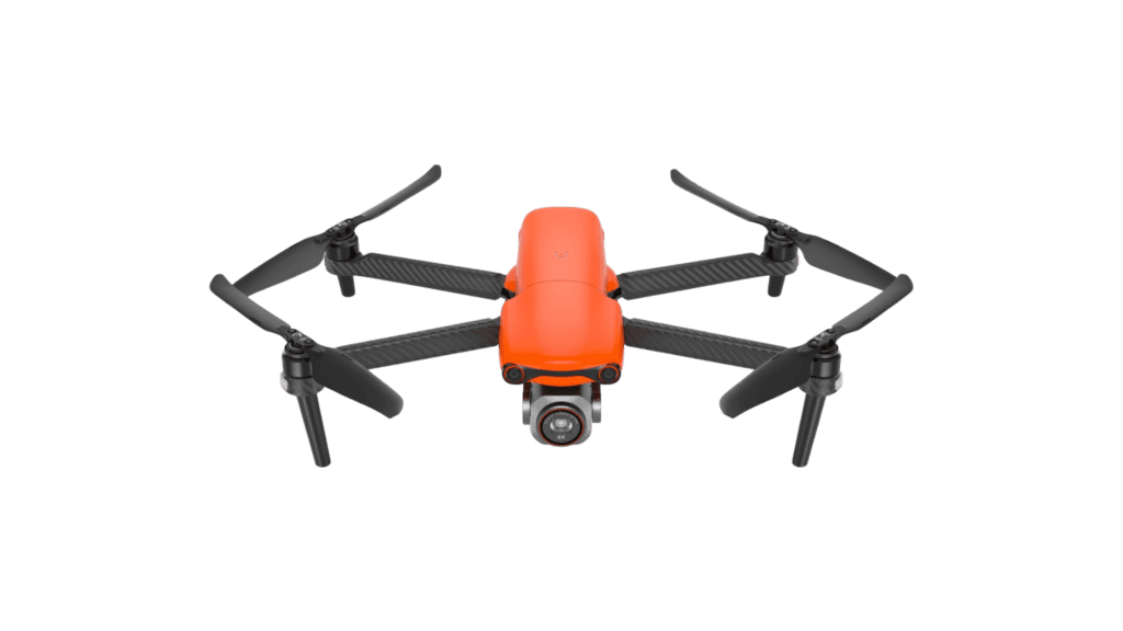 An orange and black long range drone on a green background.