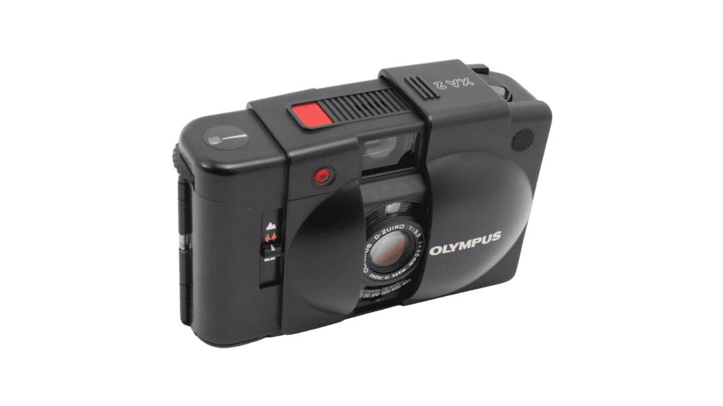 A black camera with a red button - one of the best point and shoot film cameras on the market.
