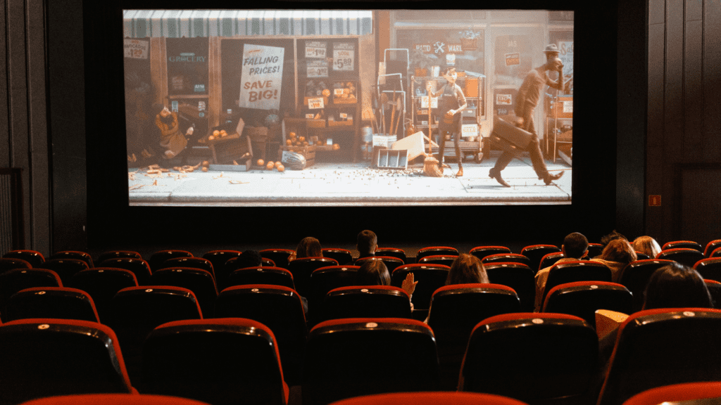 A screen showing a movie in a theater.