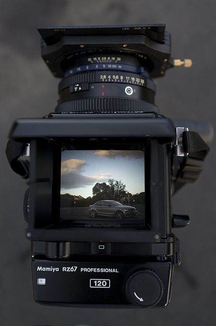 A Mamiya RZ67 with a camera attached to it.