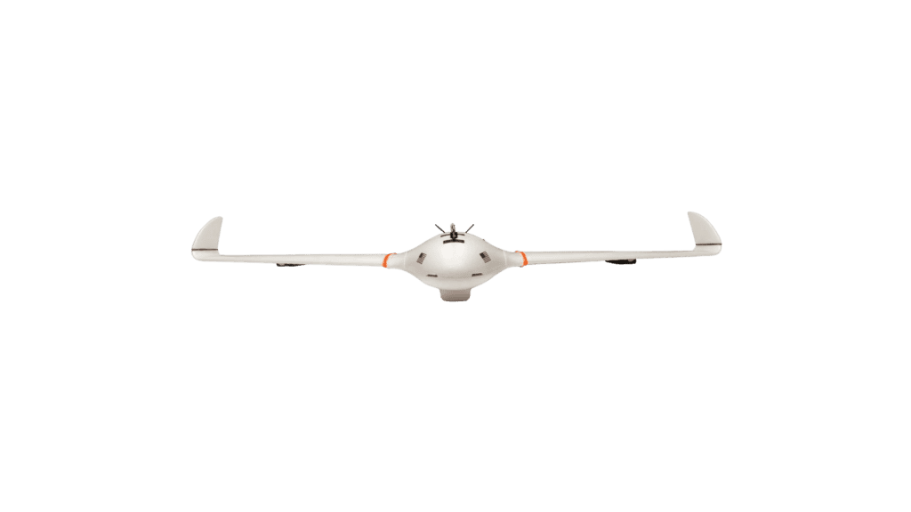 A white long-range drone flying over a green background.