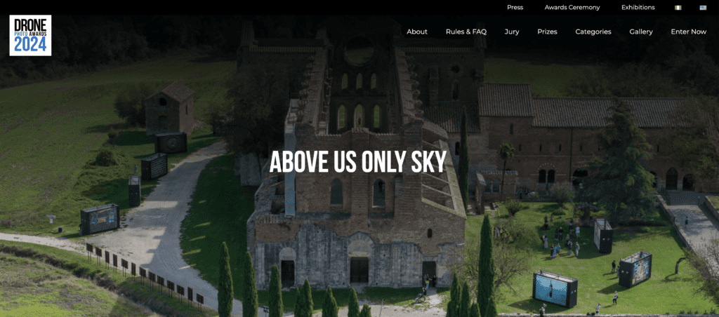 Aerial view of a historic building with the text "above us only sky" overlaying the image.