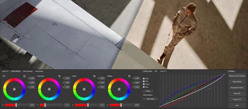 Color grading tools on a computer screen with graphical adjustments, overlaying a scene of a man leaning against an airplane wing.