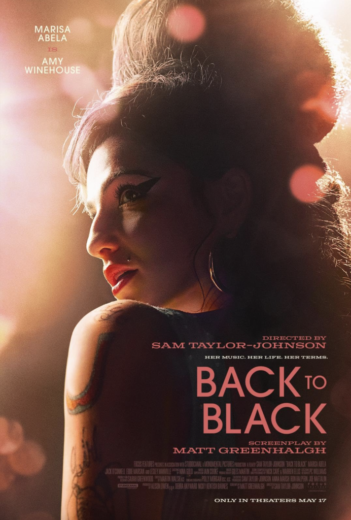 A woman with tied-up hair and tattoos faces sideways in a dimly lit scene. Text includes names of cast, director, screenplay, and the movie title "Back to Black." In theaters May 17.