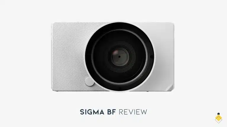 A camera lens labeled "SIGMA BF" is set against a pristine white background, offering a sleek and professional aesthetic.