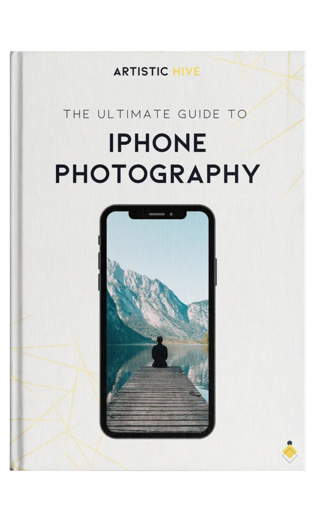 Book cover titled "The Ultimate Guide to iPhone Photography" with a smartphone displaying a man on a dock facing a lake and mountains.